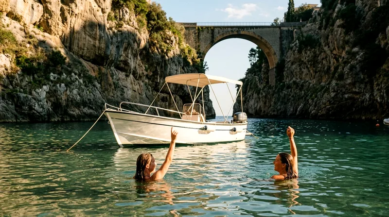 Small motorboat anchored with swimmers in water during afternoon.