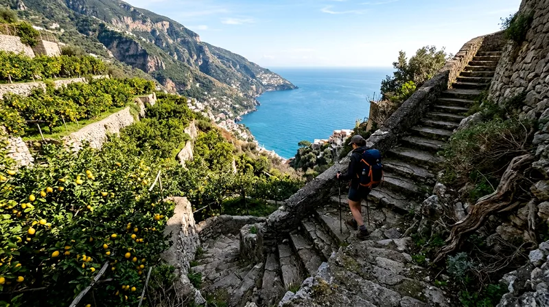 Hiker descending ancient stone steps on the Path of the Gods with sea views below